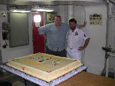 Paul Clark, PO Paul Graham and Abe Lincoln CPO MS helping out with the cake for the cocktail party onboard.   Over 800 V.I.P. and guest s of Perth W.A. attended  the cocktail party